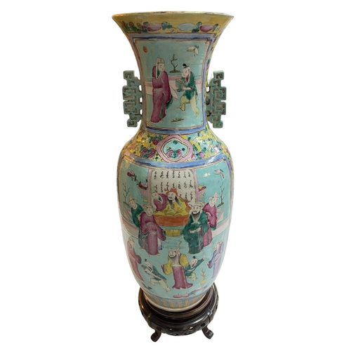 132 - Large Chinese Famille Rose two handled vase decorate with figures on carved wood stand, total height... 