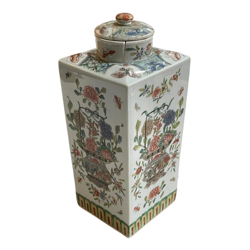 140 - Chinese square form vase and lid decorated with floral and butterfly scenes, 27.5cm.