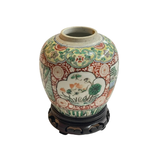 141 - Chinese famille verte baluster jar decorated with panels on floral ground, twin ring mark to base on... 