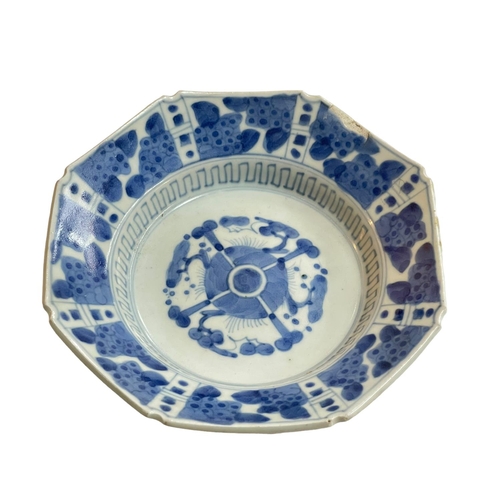 152 - Chinese blue and white octagonal dish raised on three feet, 18cm diameter.