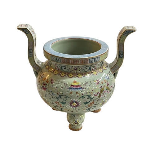 153 - Chinese lime green ground famille rose two handled incense burner raised on three bulbous legs, 27cm... 