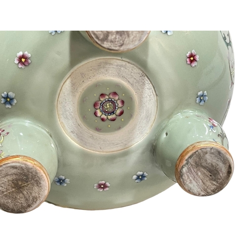 153 - Chinese lime green ground famille rose two handled incense burner raised on three bulbous legs, 27cm... 