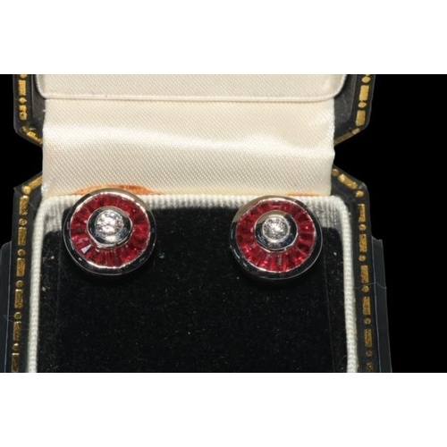 192 - Pair ruby and diamond 18 carat white gold earrings, each having approximately 0.3 carat diamond bord... 