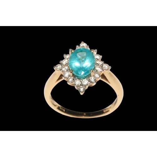 194 - Apatite and diamond 14 carat yellow gold ring, the oval cut apatite bordered with 20 diamonds, size ... 