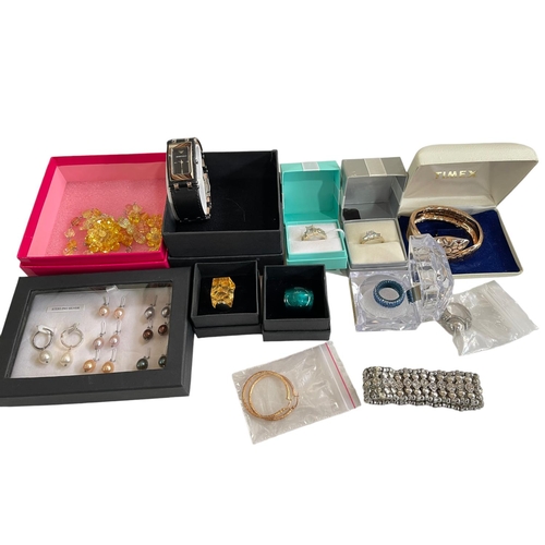 202 - Collection of jewellery including Swarovski, 9 carat gold earrings, and Armani wristwatch.