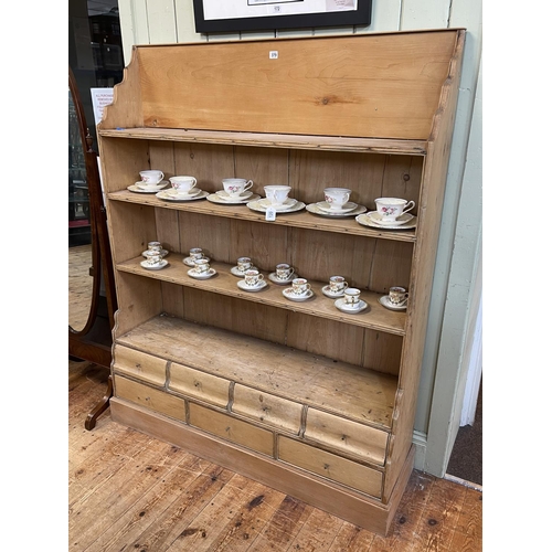 379 - Victorian pine open bookcase with seven base drawers, 159cm by 126cm by 37cm.