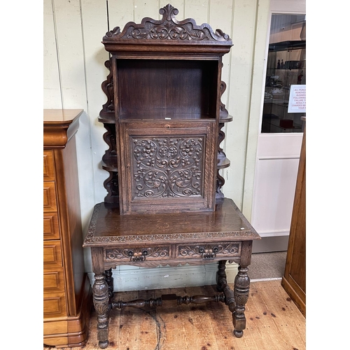 382 - Victorian carved oak writing cabinet, the fall front flanked by open compartments above a two drawer... 