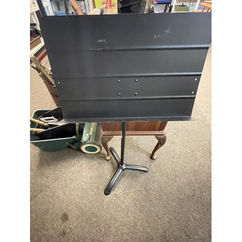 90 - Cased saxophone and metal music stand.