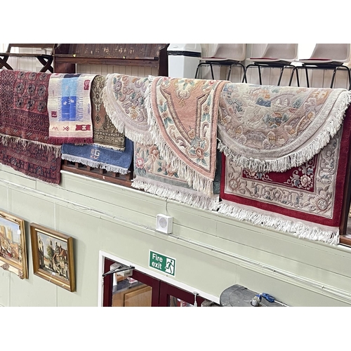 333 - Collection of five various rugs including two Persian design, largest 1.96 by 1.12, along with a col... 