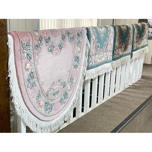 334 - Light rose oval Chinese rug 1.52 by 0.91 and three green Chinese rugs 1.00 by 0.61 (4).