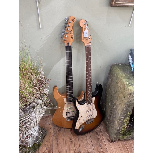 119 - Two electric guitars, named Strat Squire and Pacifica Yamaha.