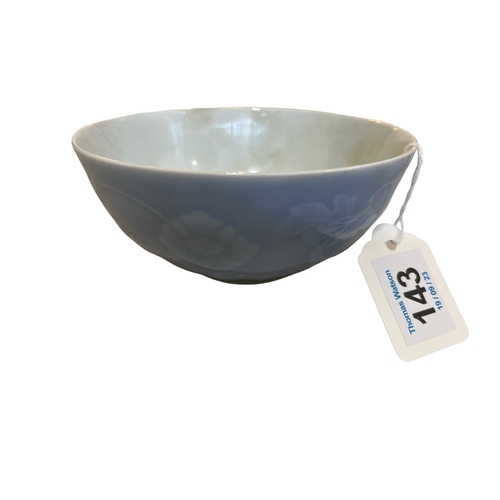 143 - Chinese blue bowl with relief flowers and lotus border, six character mark, 13cm diameter.