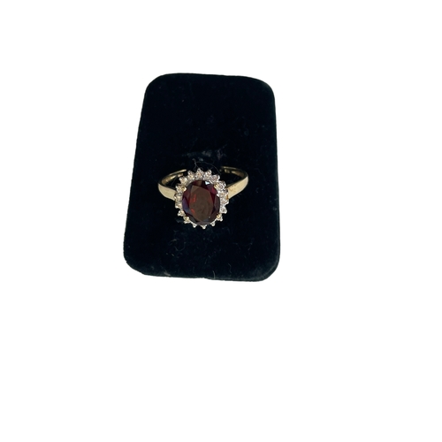 159 - Garnet and diamond cluster 9 carat gold ring, size R/S.