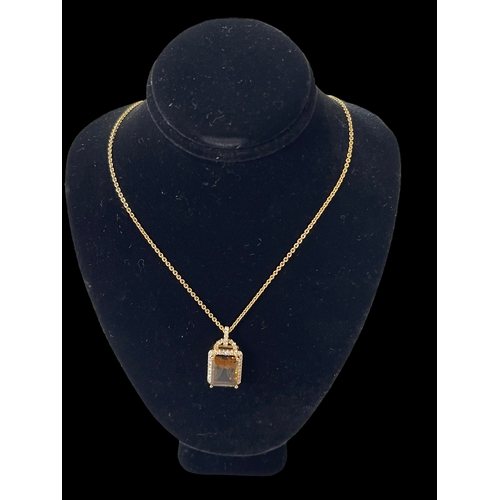 179 - Diamond and citrine 18 carat gold pendant with 18 carat gold chain necklace, pendant 2cm by 1.25cm.