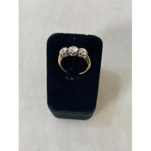 190 - Three stone diamond 18 carat gold ring, total approximately 1.5 carat, size N.