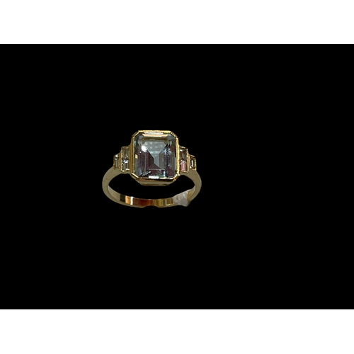 194 - Aquamarine and diamond 18 carat gold ring having emerald cut aqua with baguette shoulders, size N/O.