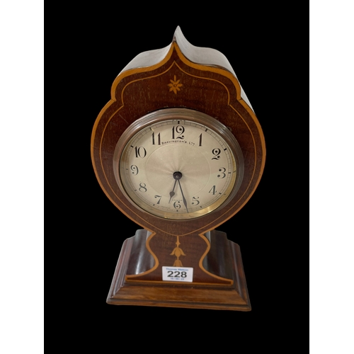 228 - Inlaid mahogany balloon mantel clock, dial signed Bravingtons Ltd, London, 26cm.