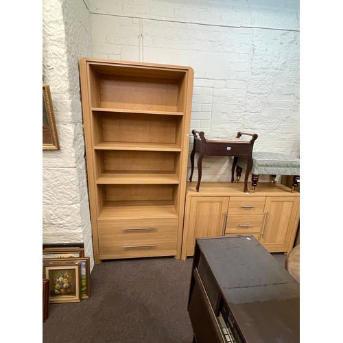 344 - Four piece suite of contemporary oak finish furniture comprising two drawer open bookcase, two door ... 