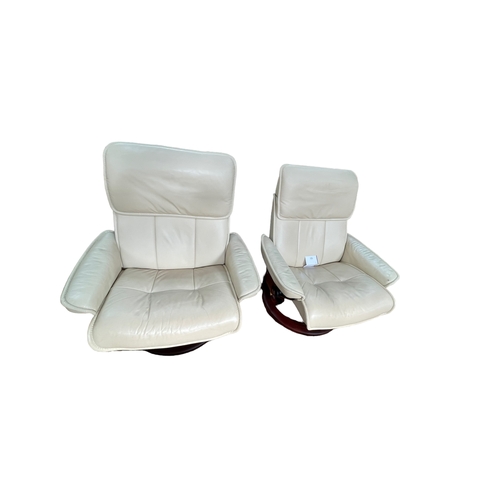 376 - Pair Stressless ivory leather reclining chairs.