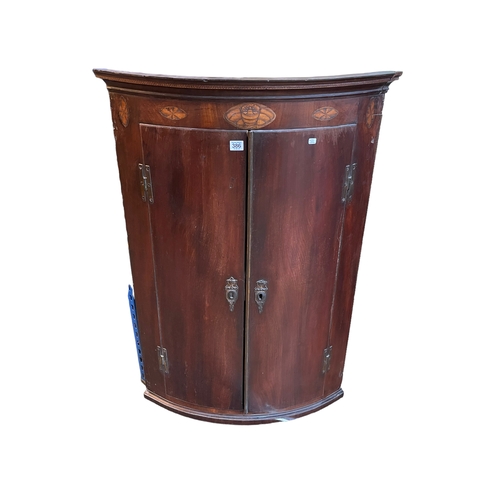 386 - Inlaid mahogany two door bow front corner wall cabinet 108cm.