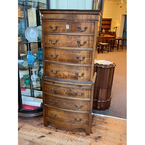 388 - Mahogany seven drawer bow front tallboy chest with brush slide, 157cm by 69cm by 43cm.