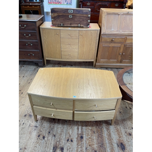 396 - Little used contemporary light oak bow front sideboard and matching four drawer low centre table, si... 