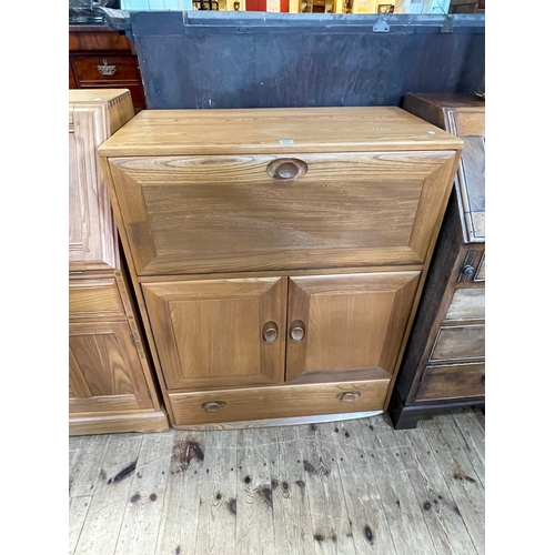 401 - Ercol Windsor drinks cabinet, the fall front above two cupboard doors and base drawer, 102.5cm by 82... 