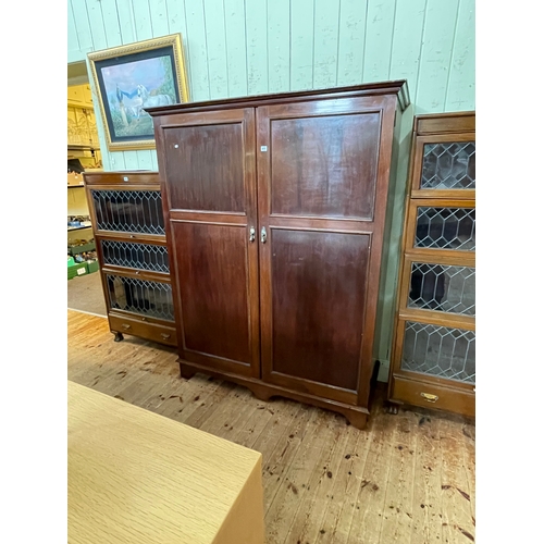 411 - Early 20th Century mahogany two door compactum wardrobe, 177cm by 137.5cm by 55cm.