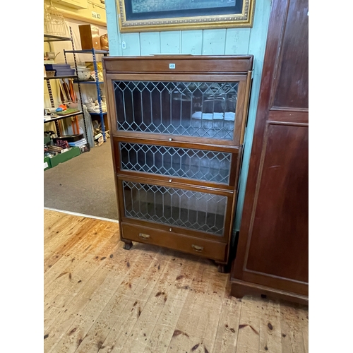 412 - Early 20th Century mahogany three height leaded glazed door bookcase with base drawer, 143cm by 87cm... 