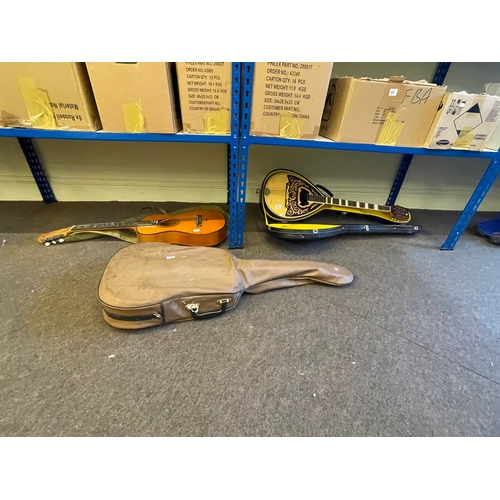 66 - Two guitars, inlaid Bouzouki in case and antique violin with label and case.