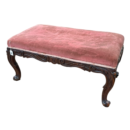 342 - Large Victorian carved mahogany stool on cabriole legs, 43cm by 89cm by 52cm.