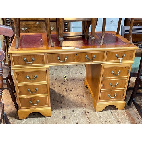 350 - Yew six drawer pedestal desk, 78cm by 122cm by 61cm.