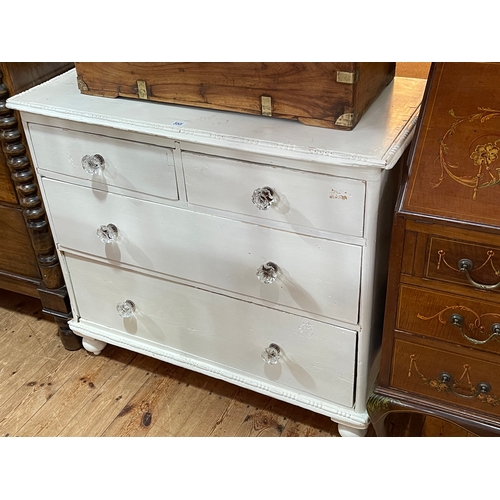 355 - Painted pine chest of two short above two long drawers on turned legs, 86cm by 47cm by 47cm.