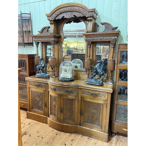 363 - Late Victorian carved oak mirror back sideboard, the canopied mirror back above a bow front centre b... 