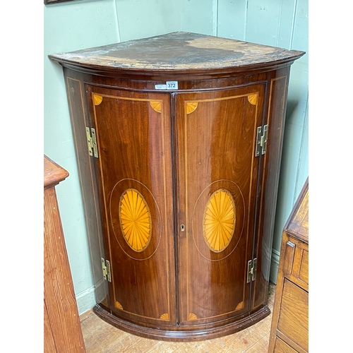 372 - George III inlaid mahogany two door bow front corner wall cabinet, 105.5cm.