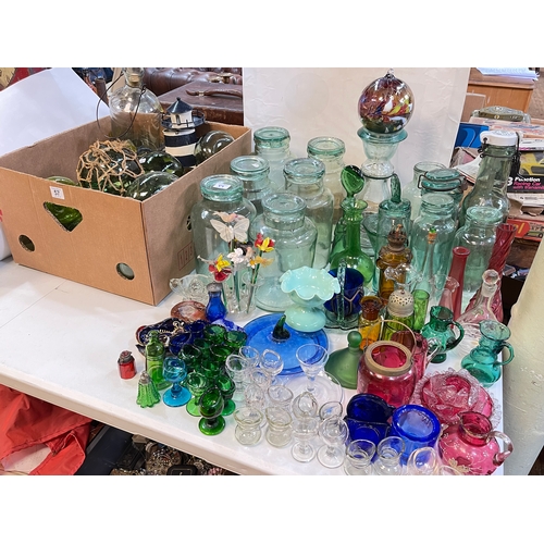 57 - Collection of Victorian glass floats, Victorian eye baths, glass storage jars, etc.