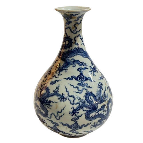 150 - Blue and white Chinese ovoid vase decorated with dragons, six character Chenghua mark to base, 27cm.