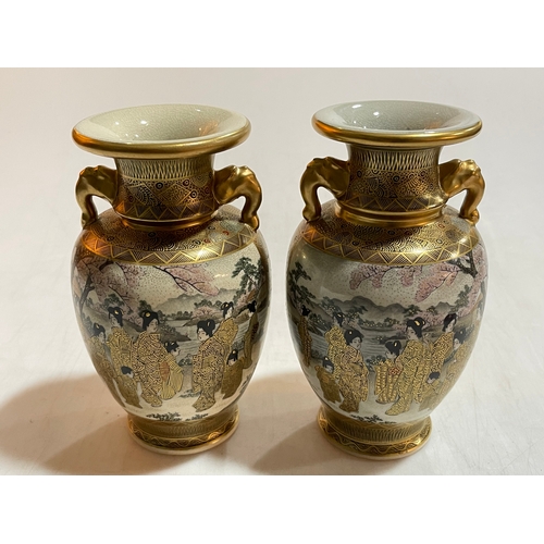 161 - Pair of two handled Japanese Satsuma vases decorated with Geisha in landscape, 18cm.