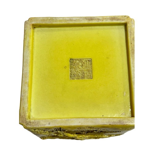 163 - Chinese yellow ground square form brush pot decorated with raised tree and village and verse scenes,... 