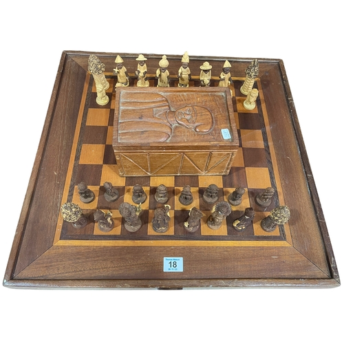 18 - Ghanaian carved chess set with box and chess board.