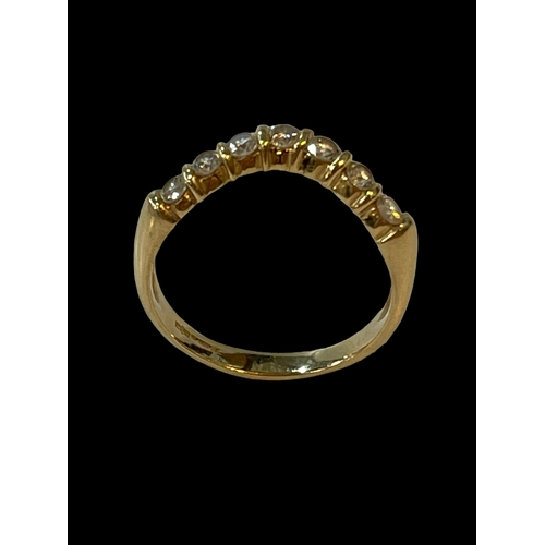 183 - Seven stone diamond wishbone design ring set in 18 carat yellow gold, size S.