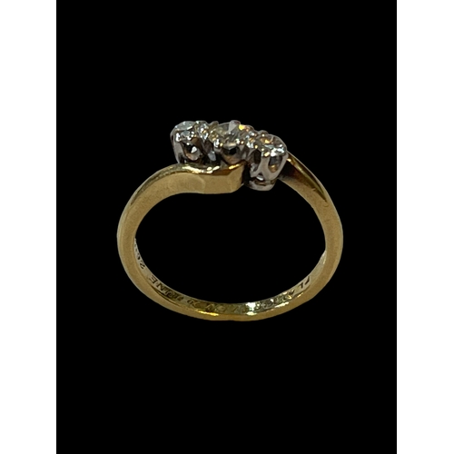 185 - 18 carat yellow gold and platinum set three stone diamond ring, size K.