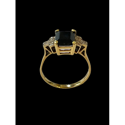 204 - Sapphire and diamond 18 carat gold ring, size R.