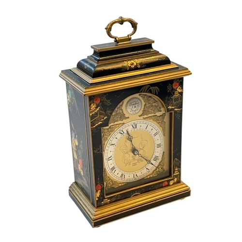 217 - Elliott mantel clock with chinoiserie decorated case, 28cm to top of handle.