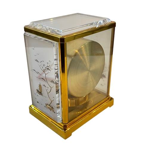 222 - Jaeger Le Coultre gilt brass chinoiserie Atmos clock, plexi panels, 23cm high, 14cm depth.