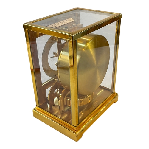 224 - Jaeger Le Coultre gilt brass Tuxedo Atmos clock, with fluted front door, 22.5cm high, 13.5cm depth.