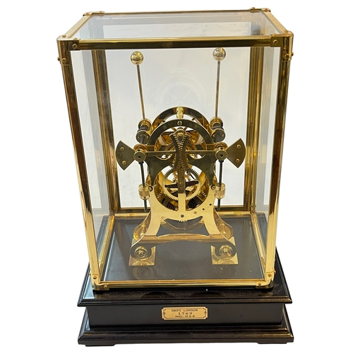 225 - Dent 1769 London replica skeleton clock under gilt brass glazed case, 34cm high, 24cm by 10cm base.