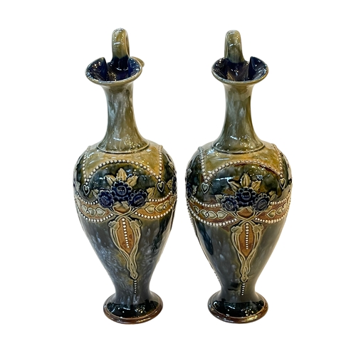 256 - Pair Royal Doulton stoneware ewers, 29cm.