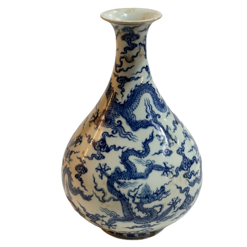 173 - Blue and white Chinese ovoid vase decorated with dragons, six character Chenghua mark to base, 27cm.