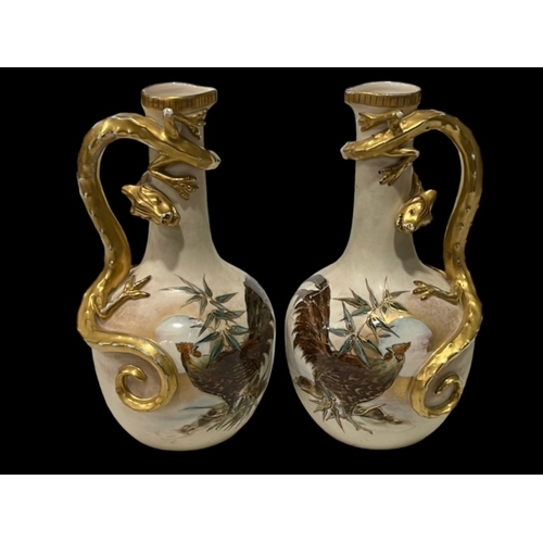 280 - Pair of Continental vases with rooster decoration and lizard handles, 25cm.